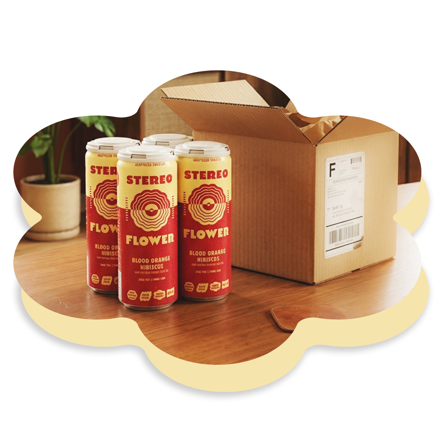 Three cans of Stereo Flower Blood Orange Hibiscus next to a cardboard box on a wooden surface.